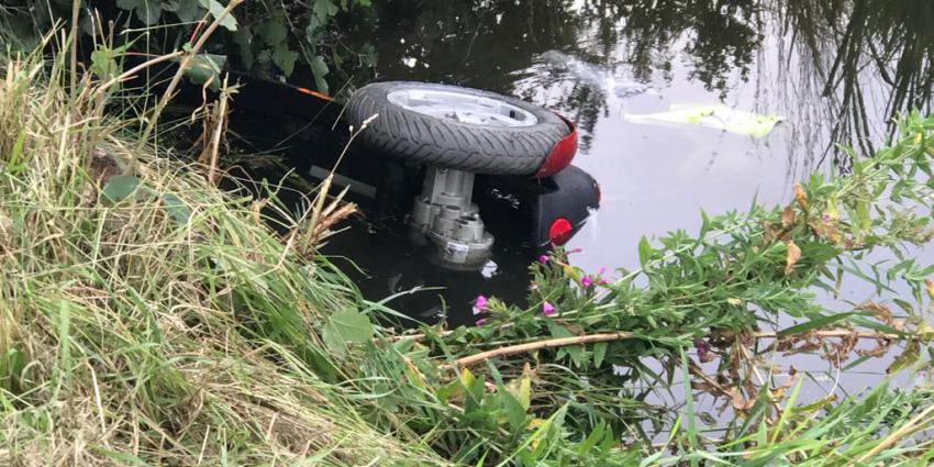 Scootmobiel in het water