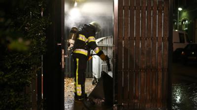 Afvalcontainer in containerhok in brand Bracbant Boxtel