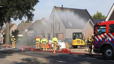 brandweer zet waterscherm in